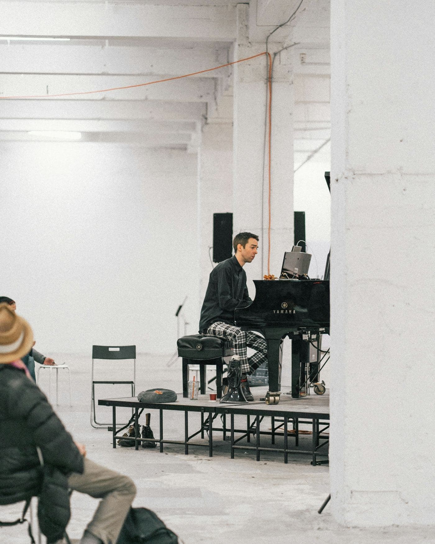 A pianist performing live at a grand piano