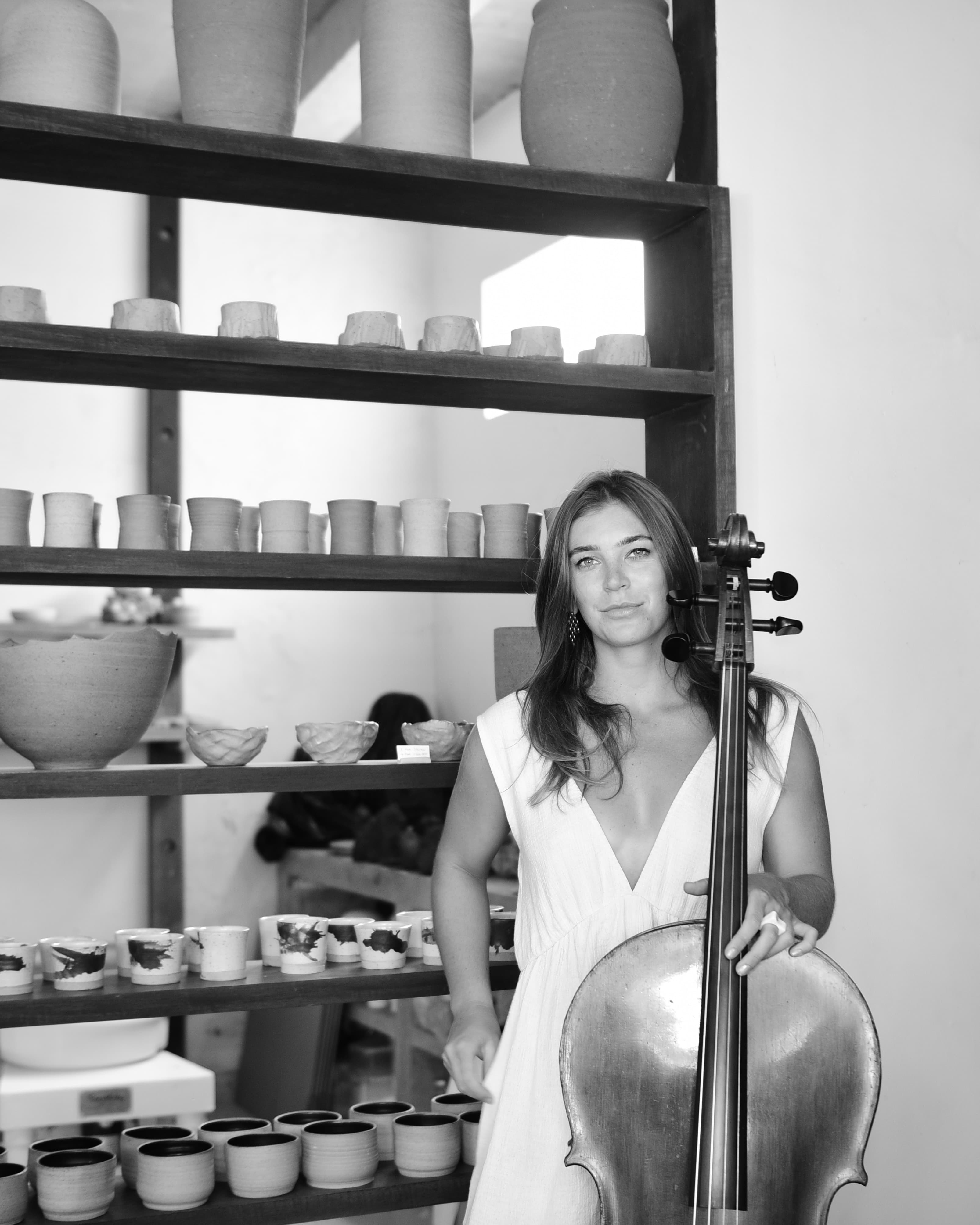 Emily, founder of Musician Gallery, playing cello
